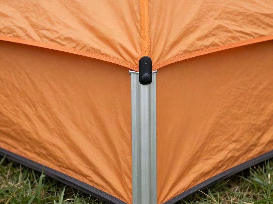 Close-up of a canopy tent leg and printed top corner