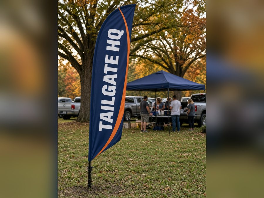 Navy and orange TAILGATE HQ feather flag at a tailgate lot